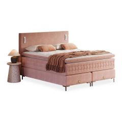 Boxspring Pure bed in roze uitvoering met luxe hoofdbord en comfortabele matrassen.