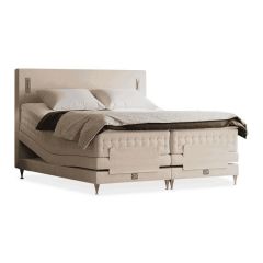 Verstelbaar Lotus bed in een luxe crème kleur, met gestikte details en een verfijnd design.